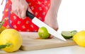 Woman cutting a lime in half Royalty Free Stock Photo