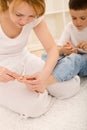 Woman cutting little boys toe nail Royalty Free Stock Photo