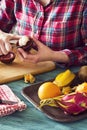 Woman Cutting Mangosteen with Knife