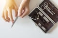 Woman cutting nails with nail clipper,Female using tweezers,Rasp Royalty Free Stock Photo