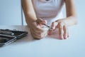 Woman cutting nails with nail clipper,Female using tweezers Royalty Free Stock Photo