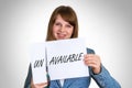 Woman cutting paper by scissors with unavailable word