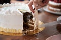 Woman cutting and serving delicious vegan birthday cake