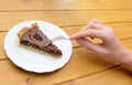 Woman cutting into a slice of pecan pie Royalty Free Stock Photo