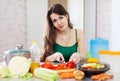 Woman cutting tomato Royalty Free Stock Photo