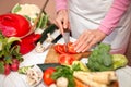 Woman cutting tomato Royalty Free Stock Photo