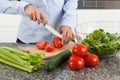 Woman cutting tomato Royalty Free Stock Photo