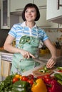 Woman cutting vegetables in the kitchen. Royalty Free Stock Photo