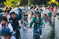 Woman cycling around other cyclists. People in Ukrainian national embroidered shirts take part in a bicycle race Royalty Free Stock Photo
