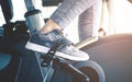 Woman is cycling on fitness spinning bike machine