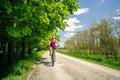 Woman cycling a mountain bike in city park, summer day Royalty Free Stock Photo