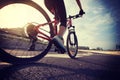 cyclist legs riding Mountain Bike on highway