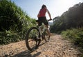 Cyclist riding a bike on a nature trail in the mountains Royalty Free Stock Photo