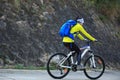 Woman cyclist riding mountain bike on forest trail Royalty Free Stock Photo