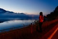 Woman at Czorsztyn Lake at dawn. Royalty Free Stock Photo