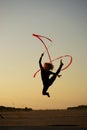 Woman dancer jumping with ribbon Royalty Free Stock Photo