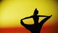 Woman dancer silhouette dancing on colorful background. Graceful dancer passionately dancing flamenco performing