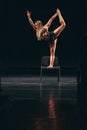 Woman dancer standing on chair during performance Royalty Free Stock Photo