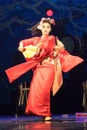 Woman dances with a fan. Kino Kitsune fox is a character in Japanese legends
