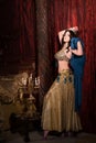 Woman dancing belly dance with shawl. Aesthetic of East Royalty Free Stock Photo
