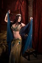 Woman dancing belly dance with shawl. Aesthetic of East Royalty Free Stock Photo