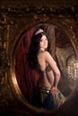 Woman dancing belly dance with shawl. Reflected in mirror. Aesthetic of East Royalty Free Stock Photo