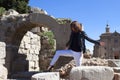 Woman dancing in front of an arch