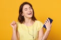 Woman dancing and listening to music in headphones from smart phone or mp3 player, happy Caucasian young woman with excited Royalty Free Stock Photo