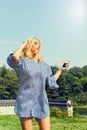 Woman dancing while listening to music in park