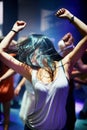 Woman, dancing and music at rave, happy and party in nightclub, festival and dj event. Disco, rock and freedom with