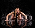 Woman dancing rain black background