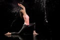 Woman dancing rain black background