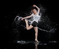 Woman dancing rain black background