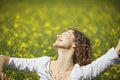 Woman dancing in rapeseed field Royalty Free Stock Photo