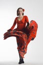 A woman dancing in red dress Royalty Free Stock Photo