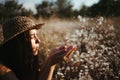 Woman on dandelion field in sunset. Allergic Royalty Free Stock Photo