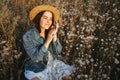 Woman on dandelion field in sunset. Allergic Royalty Free Stock Photo