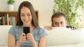 Woman dating on line and boyfriend spying