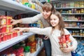 Woman with daughter buying sweet yoghurts Royalty Free Stock Photo