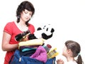 Woman and daughter hand crammed full of clothes and shoulder bag Royalty Free Stock Photo