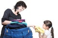 Woman and daughter hand crammed full of clothes and shoulder bag Royalty Free Stock Photo