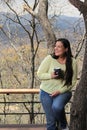 Woman at dawn in a cabin in the woods drinks coffee to activate the mind with caffeine because it is rich in antioxidants