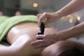 Woman in a day spa getting a stone treatment Royalty Free Stock Photo