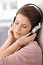 Woman daydreaming with headphone Royalty Free Stock Photo