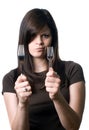 Woman deciding between plastic and reusable forks