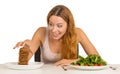 Woman deciding whether to eat healthy food or sweet cookies Royalty Free Stock Photo