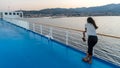 Woman on deck of ferry boat looking at town Royalty Free Stock Photo