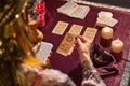 Woman with deck of tarot cards predicting future