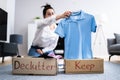 Woman Decluttering Clothes, Sorting