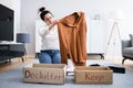 Woman Decluttering Clothes, Sorting Royalty Free Stock Photo